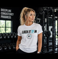 Woman wearing white Lock It TF In Tee by Vida Fit in gym setting